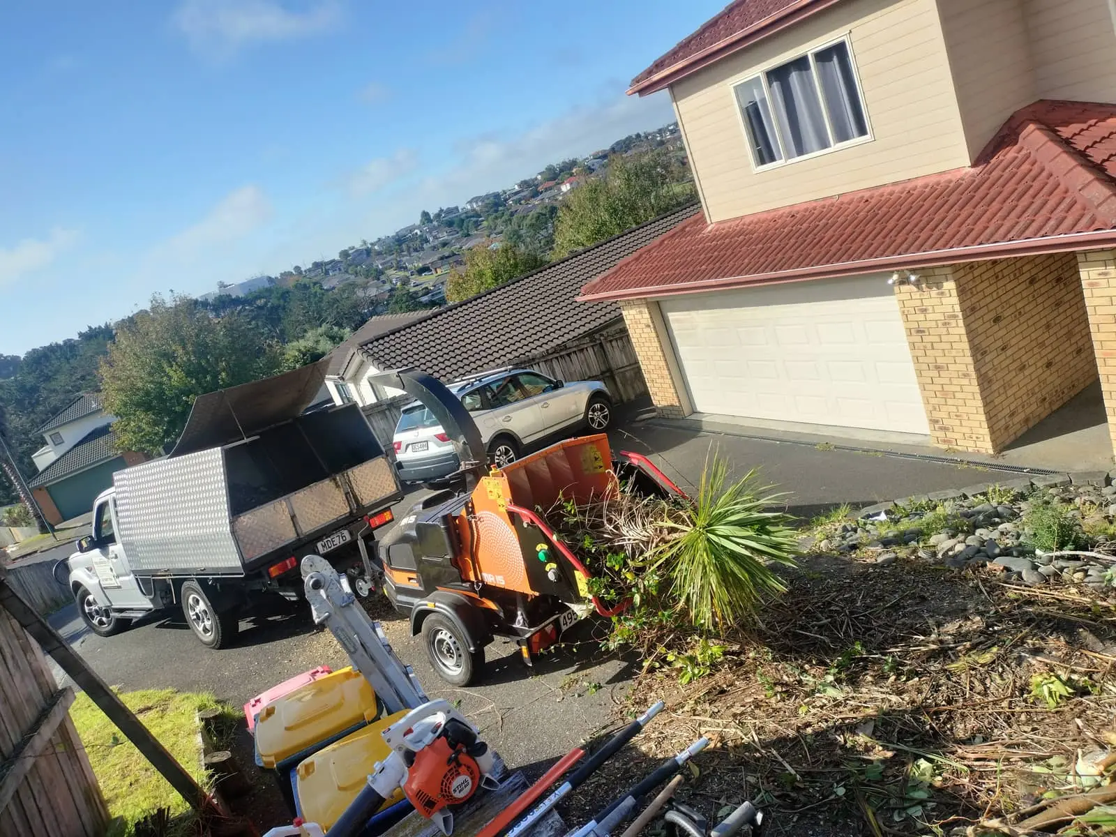 Truck and chipper at residential job site